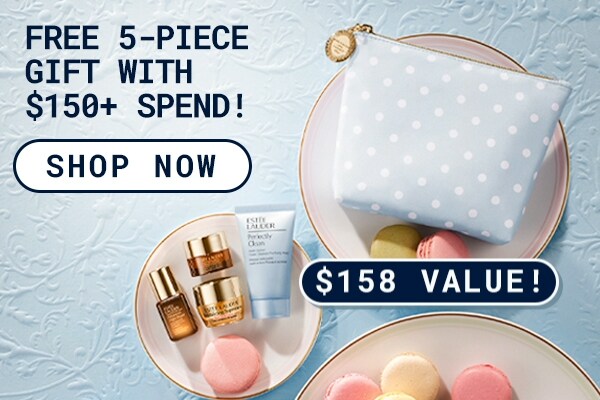 Photograph of the FREE 5 - Piece Gift with any purchase over $150. Product flatlay on plates with macarons.
