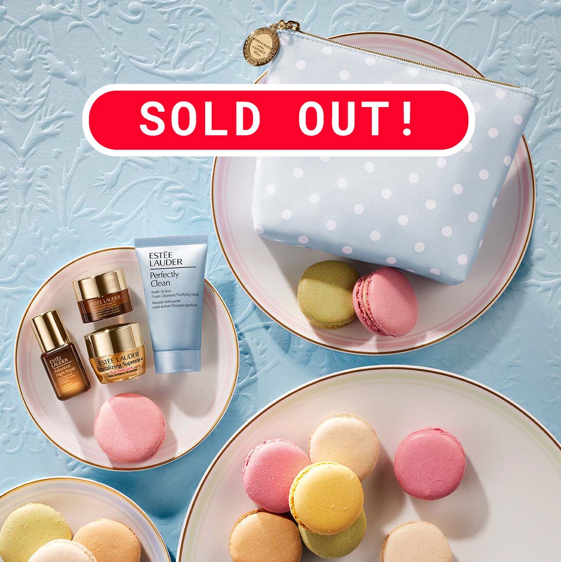 5 piece Estee Lauder gift set flat lay on plates with macarons with a sold out banner.