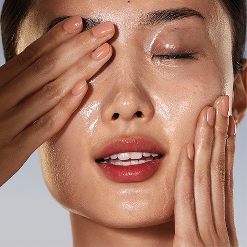 woman double cleansing skin